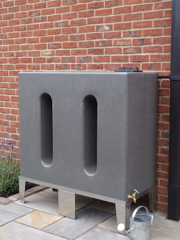 water butt mounted on a metal frame against a red brick wall outdoors.