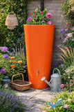 Orange rain barrel with plants in a garden setting, featuring the brand 'EcoSure'.