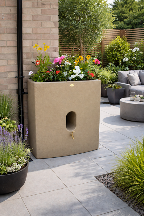Sandstone Oasis Water Butt Planter with flowers in a modern garden