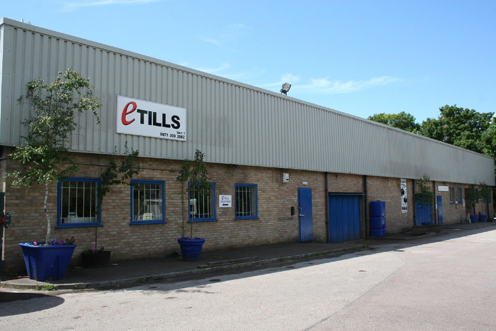 Building with eTILLS logo on a clear day