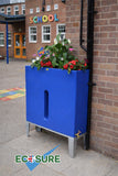 Blue water butt planter with plants against a school building, featuring the ECOSURE brand.